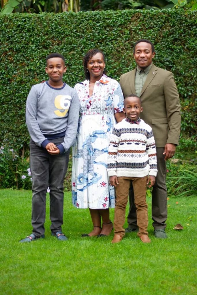 Rose with her husband and two sons in a family portrait